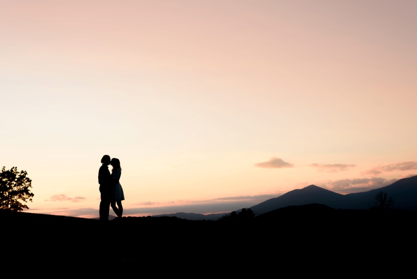 silhouette photo of engaged sweethearts