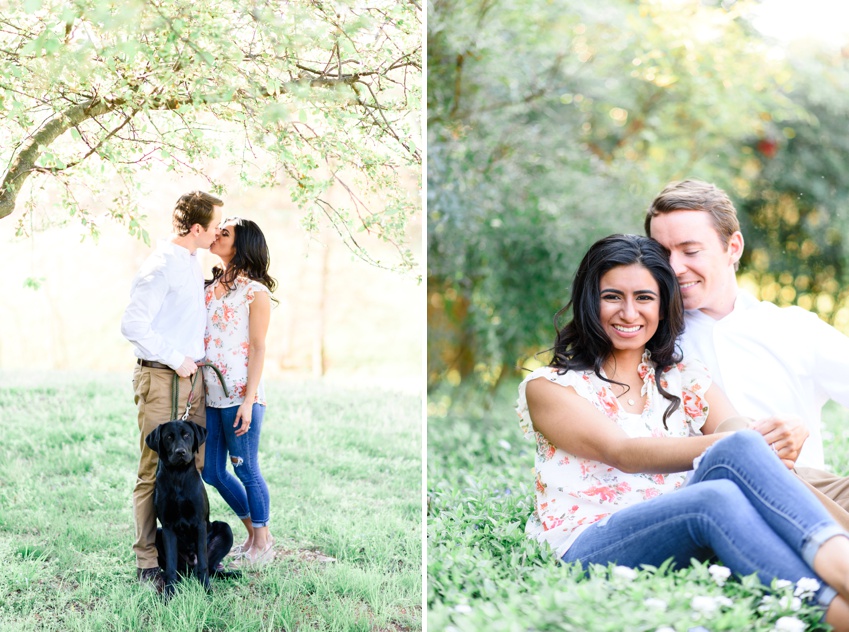 couple kissing during engagement session with their dog