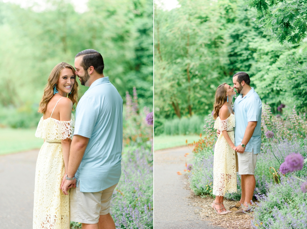 couple smiling at each other for engagement photos in vienna virginia