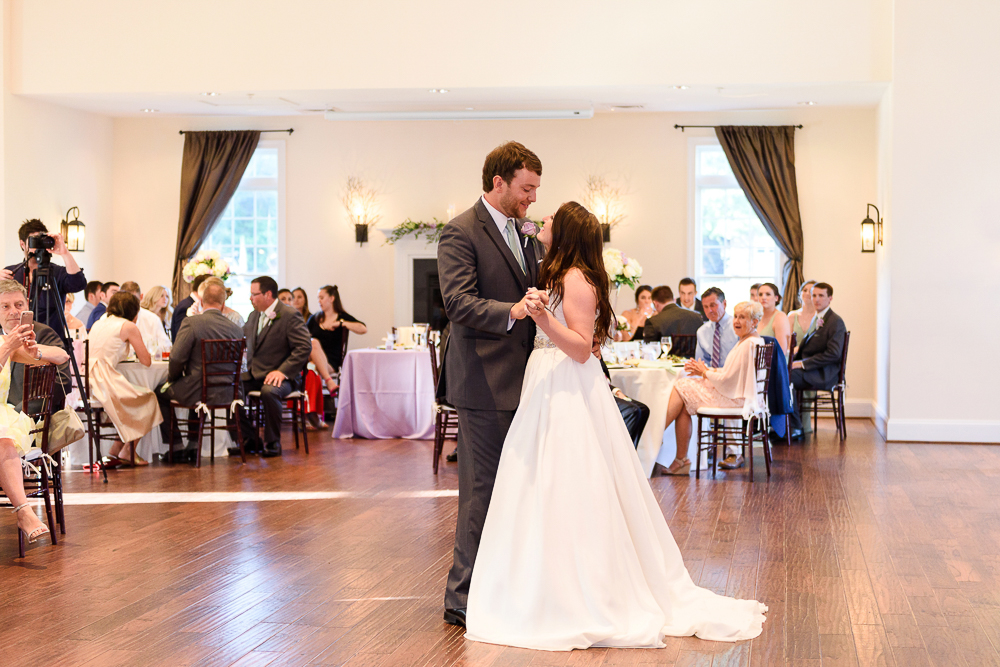 husband and wife first dance during wedding reception
