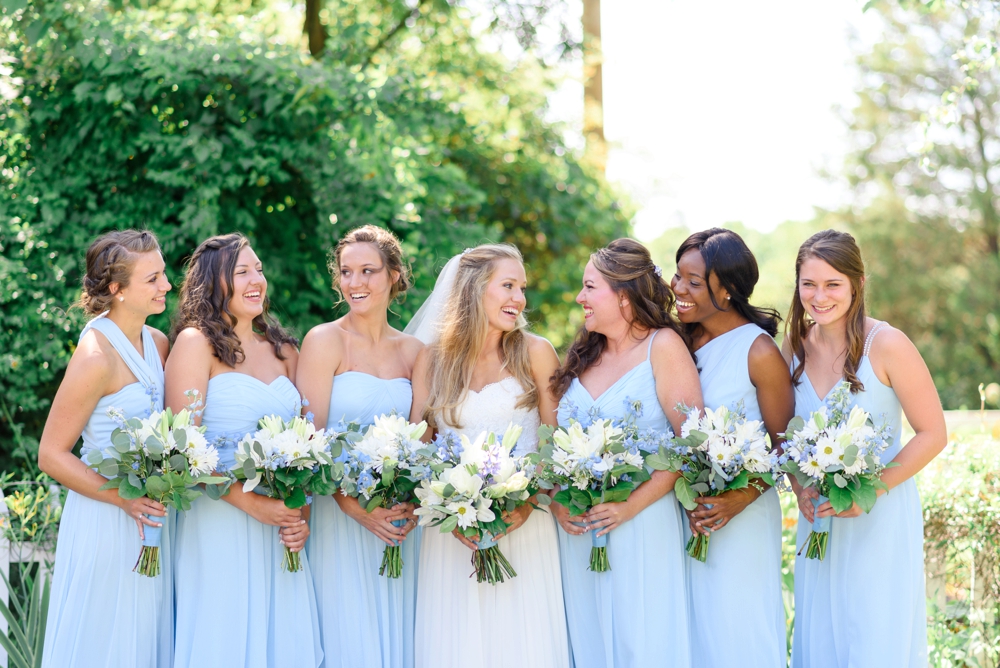 bridesmaids wearing light blue long dresses