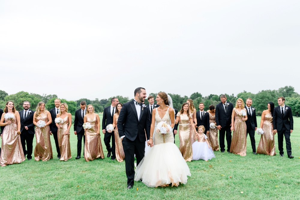 bridal party walking and laughing