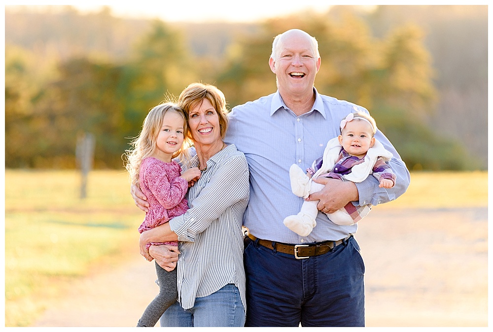 grandparents and grandchildren laughing for pictures