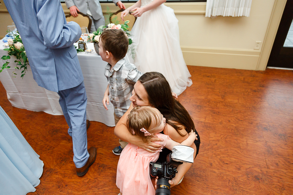 baby hugging photographer