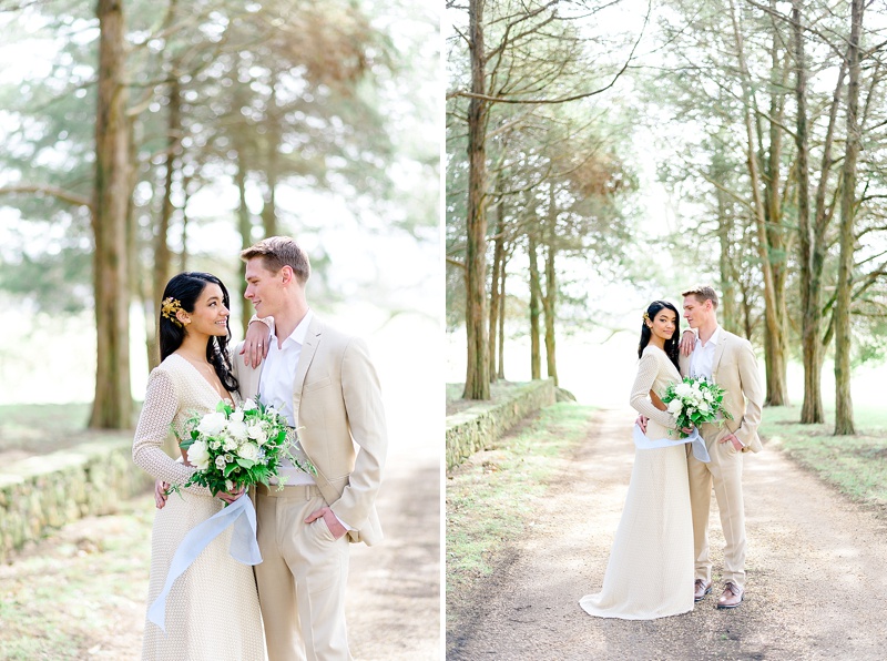 couple smiling at each other while taking photos at great marsh