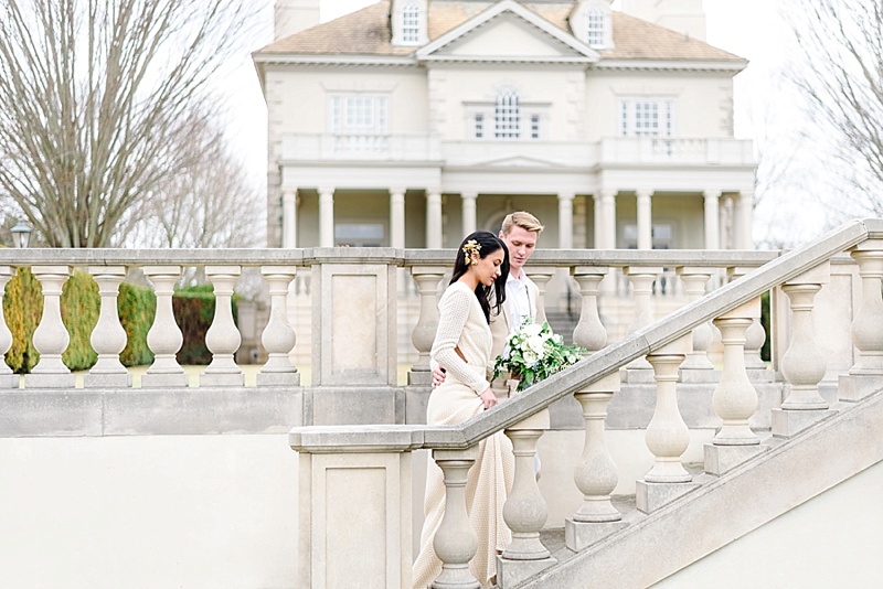 bride and groom going up the steps