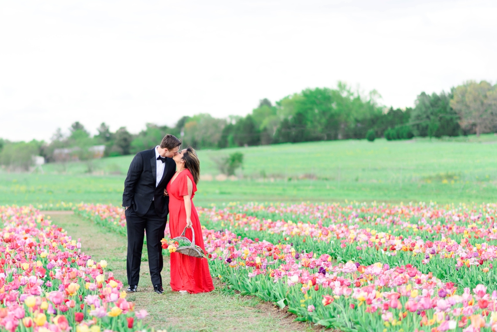 sweethearts kissing in a tulip field