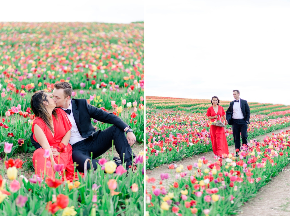 couple walking through a tulip field in Virginia