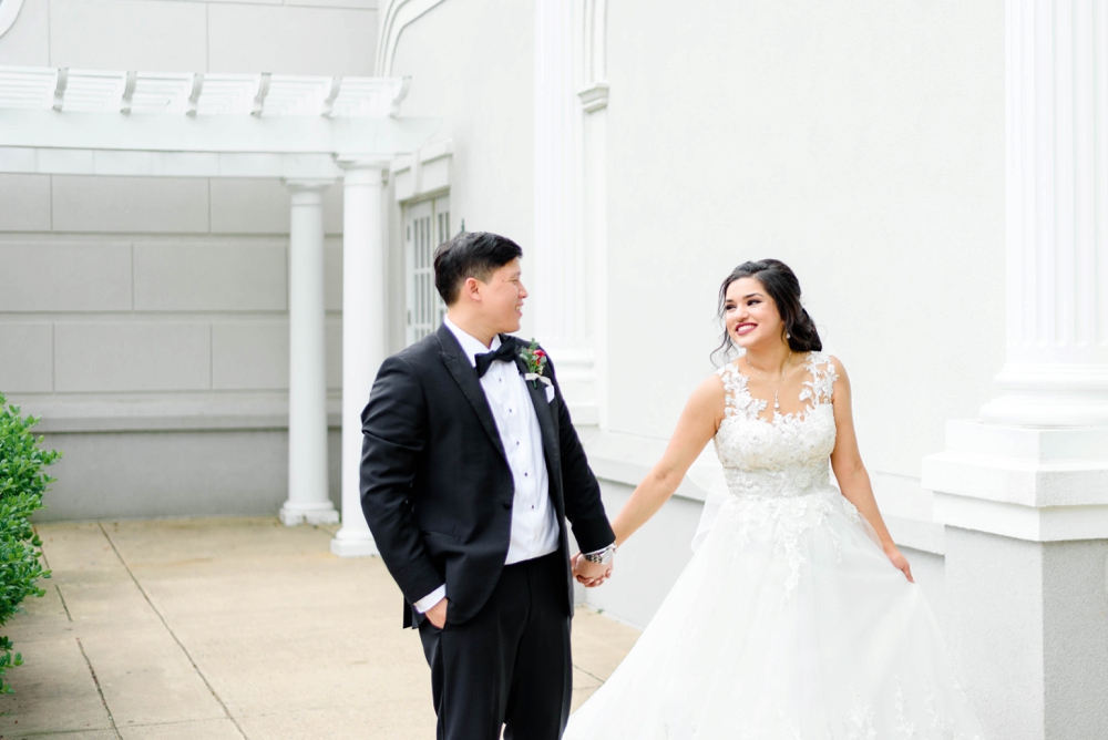 couple walking before wedding reception