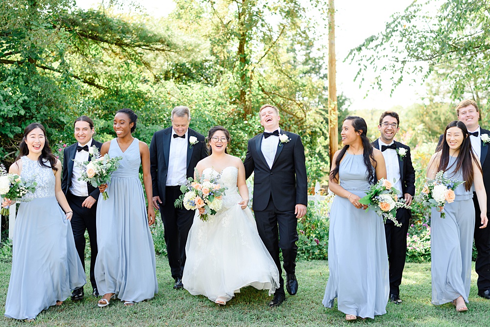 bridal party walking and laughing