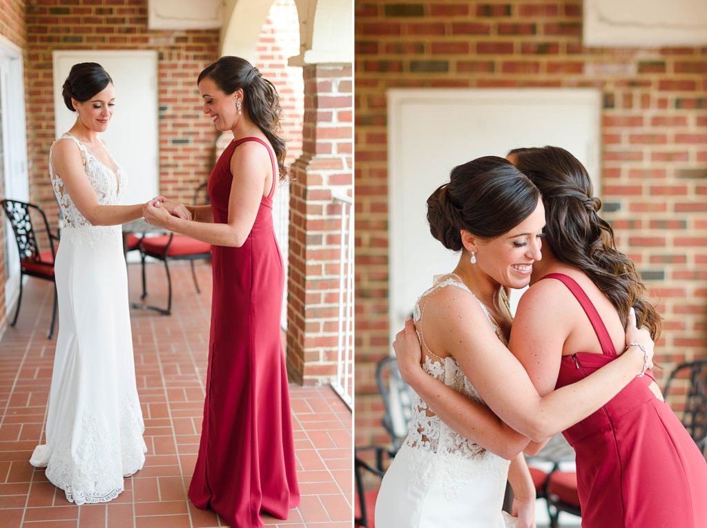bride and maid of honor hugging before outdoor ceremony