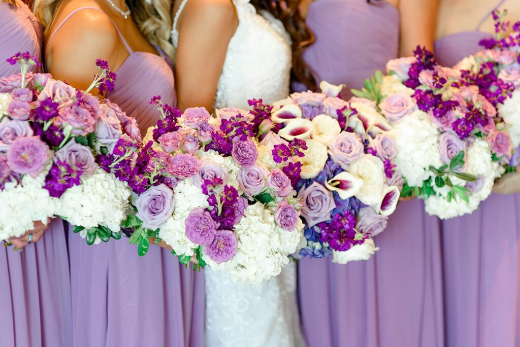 purple wedding flowers and bridesmaids dresses