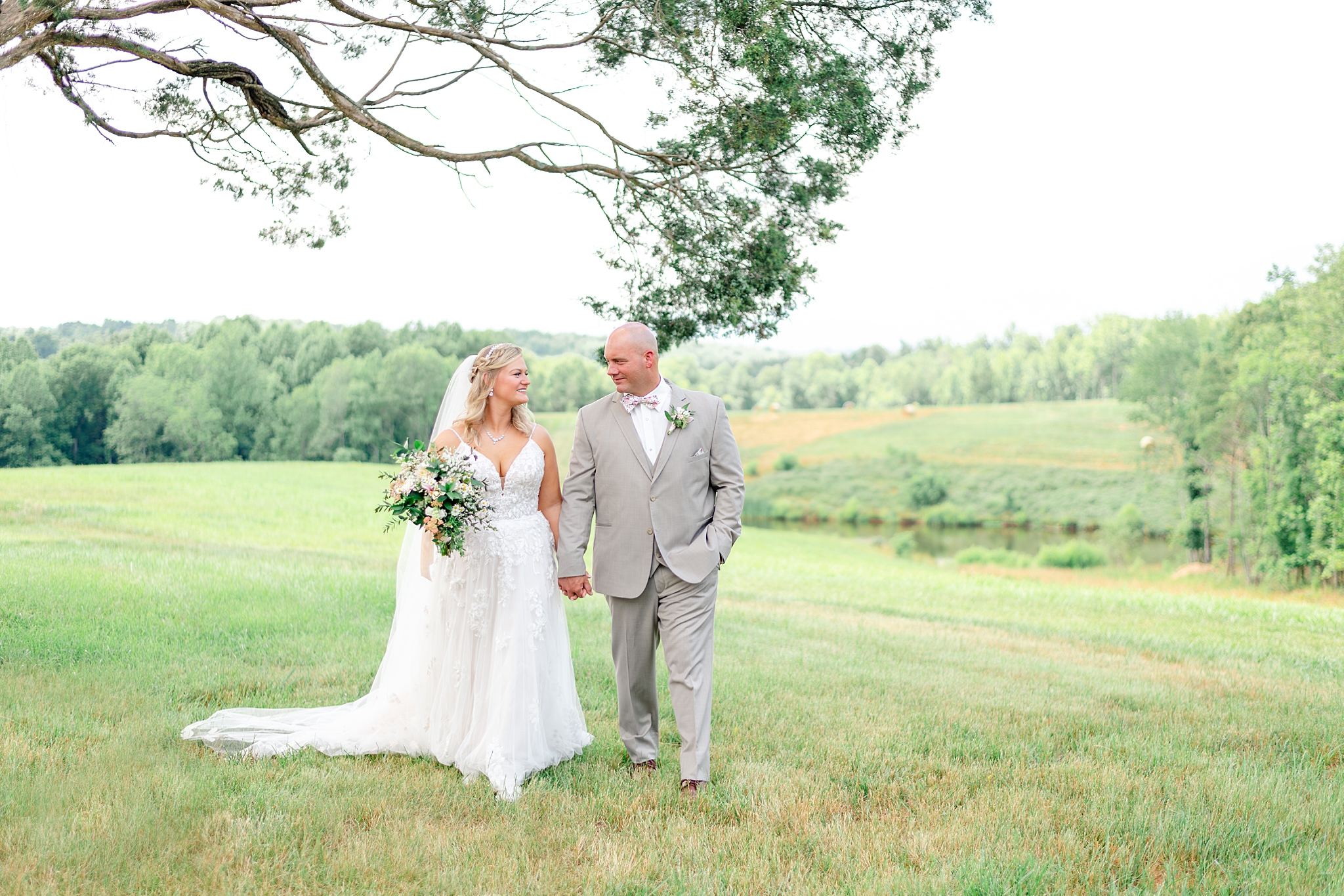 couple walking for pictures at Cedar Oaks Farm