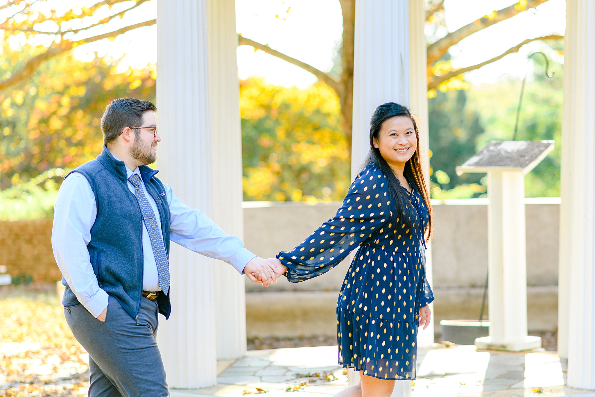 walking in the park for engagement photos in Lynchburg