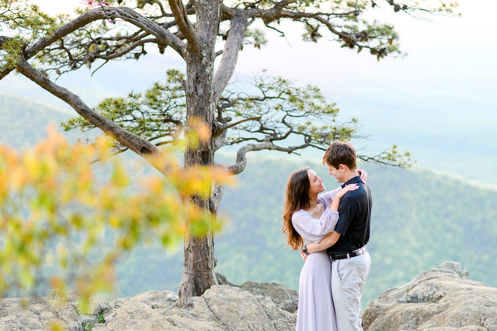 A picture-perfect engagement photo at Ravens Roost Overlook, showcasing the couple's love against the scenic backdrop.