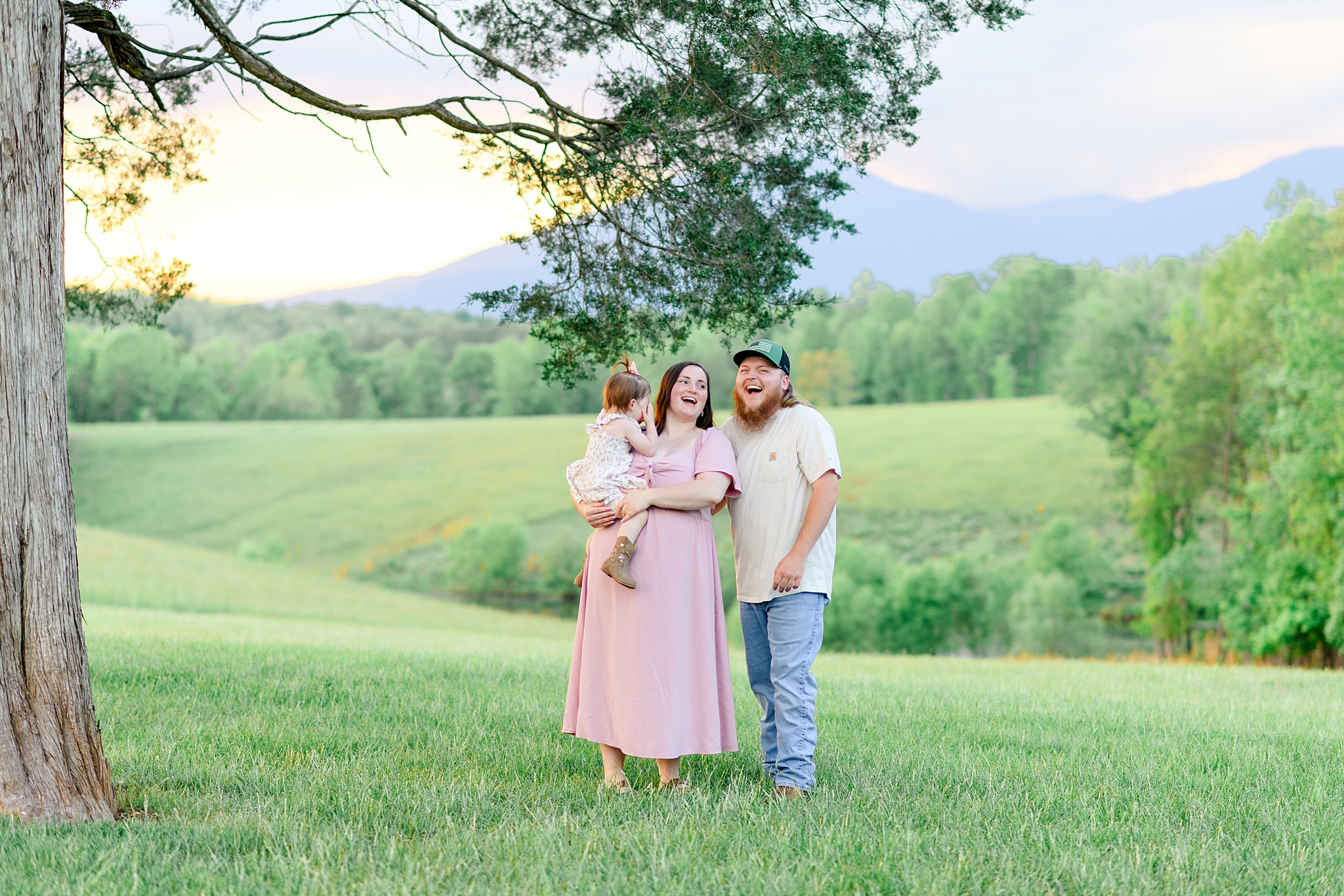 parents and toddler laughing 