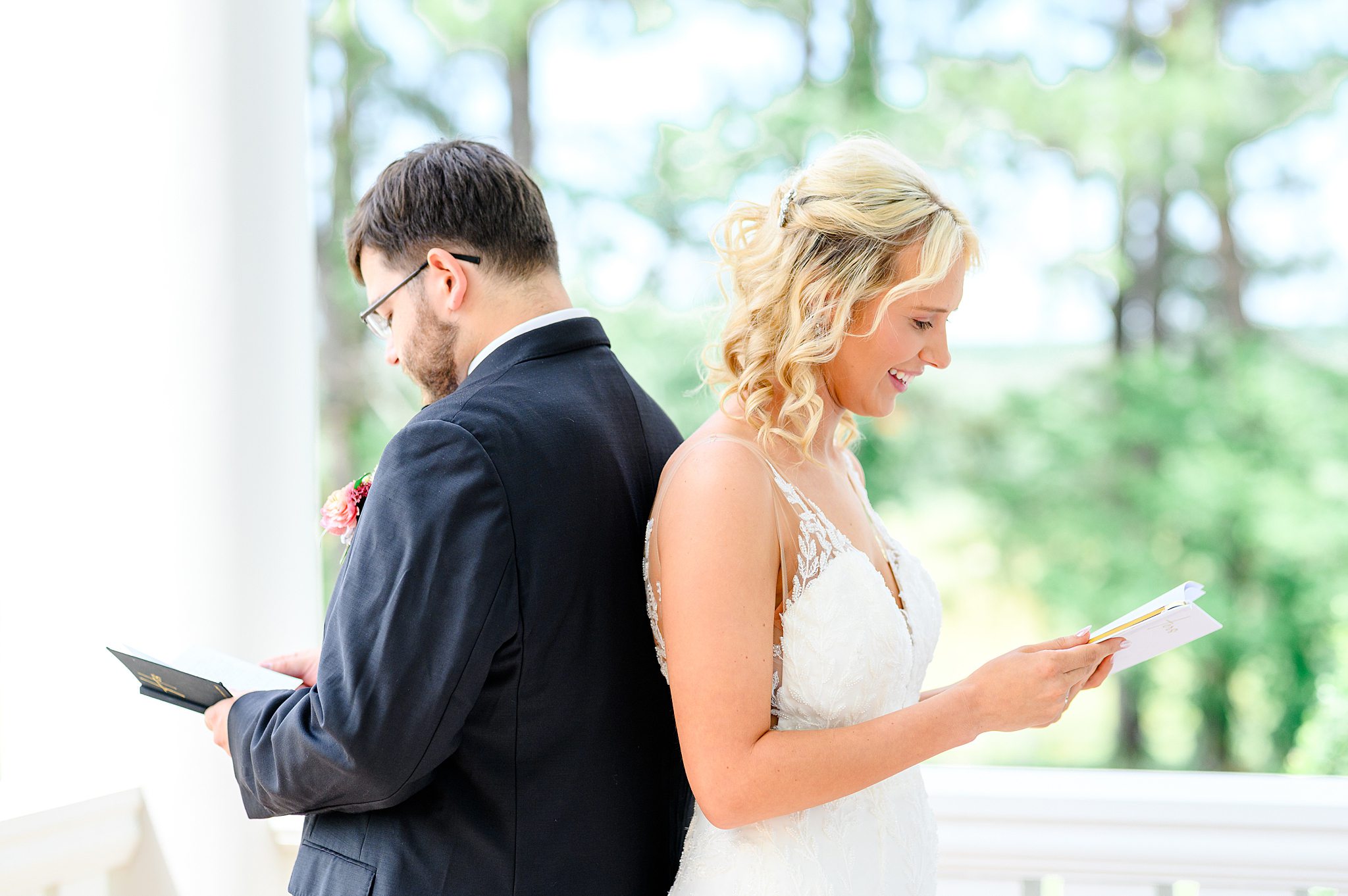 bride and groom reading private vows