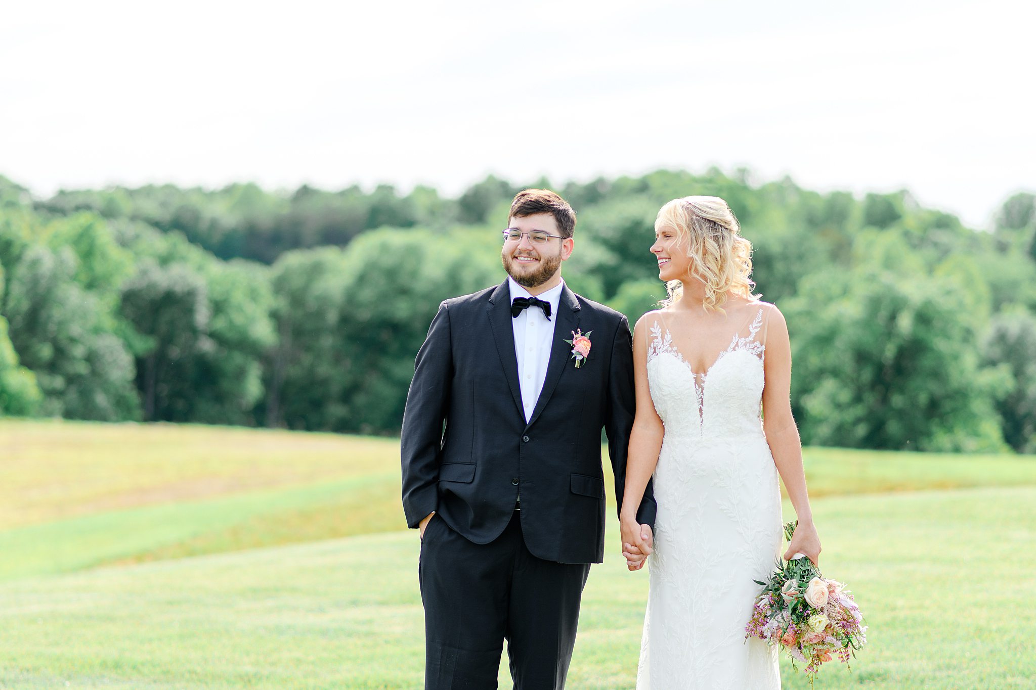 Newlyweds holding hands and walking