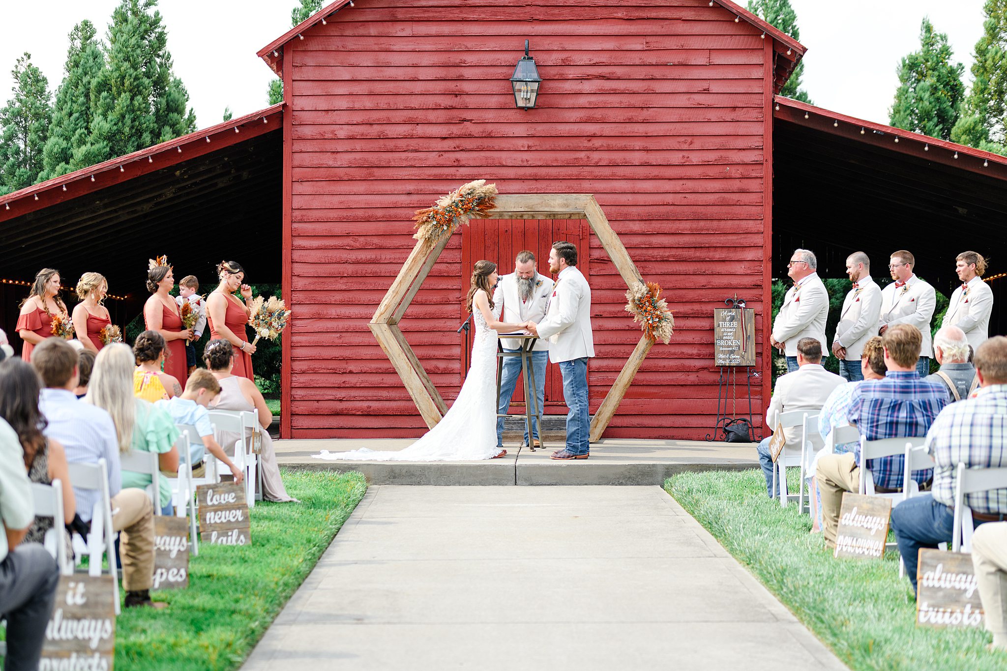 couple holding hands during wedding ceremony