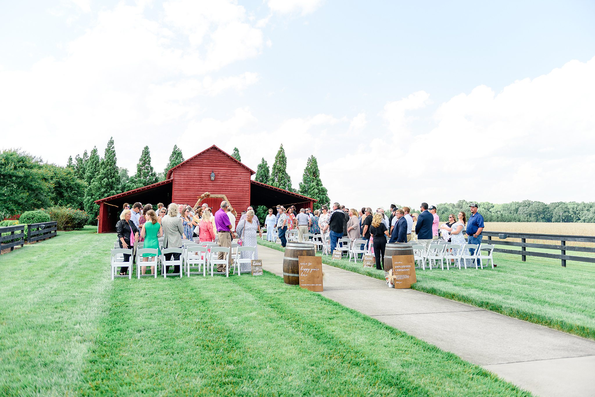 Guests standing as the couple exits the ceremony