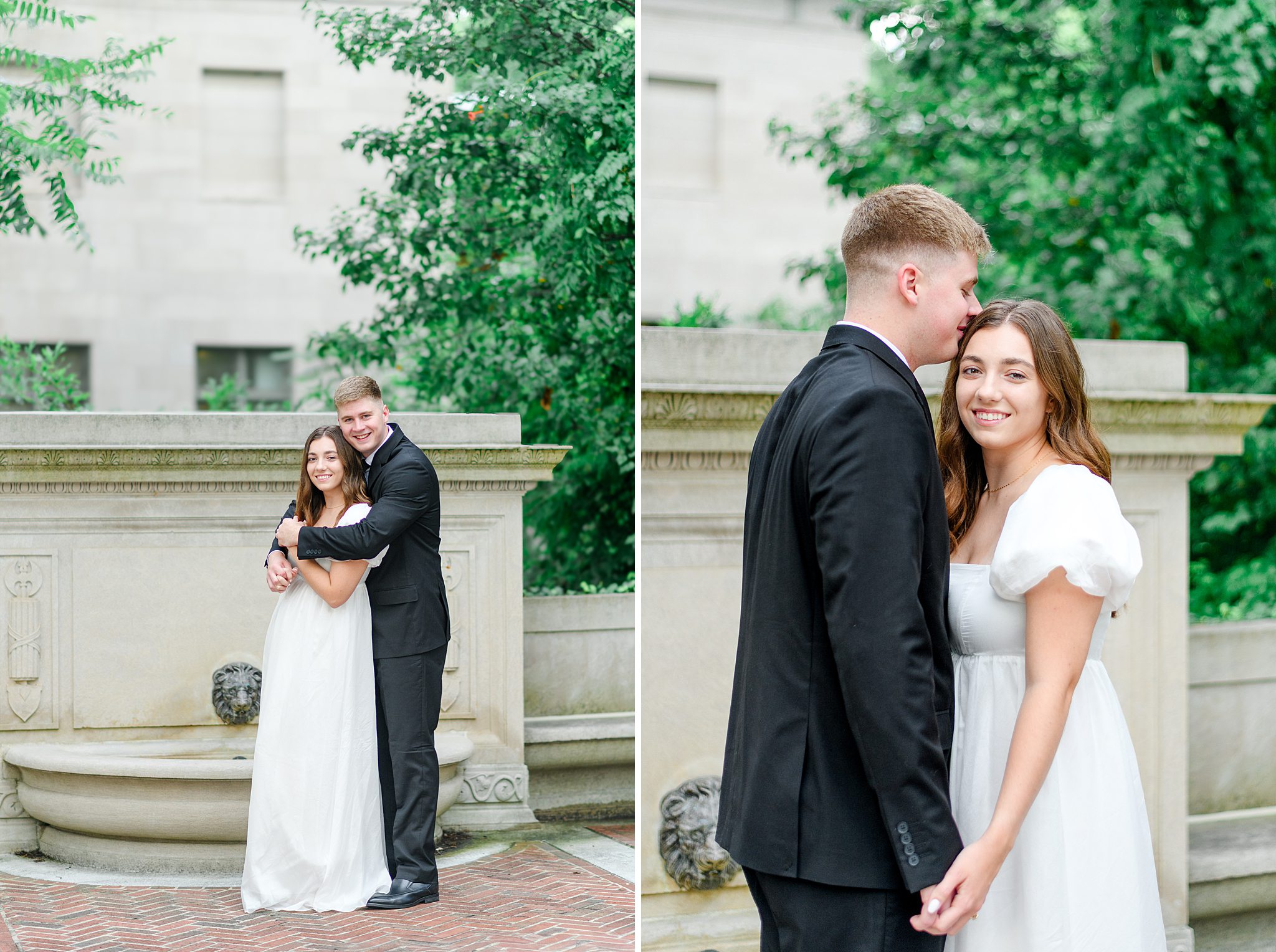 Couple embracing in front of Monument Terrace’s stone wall during engagement shoot