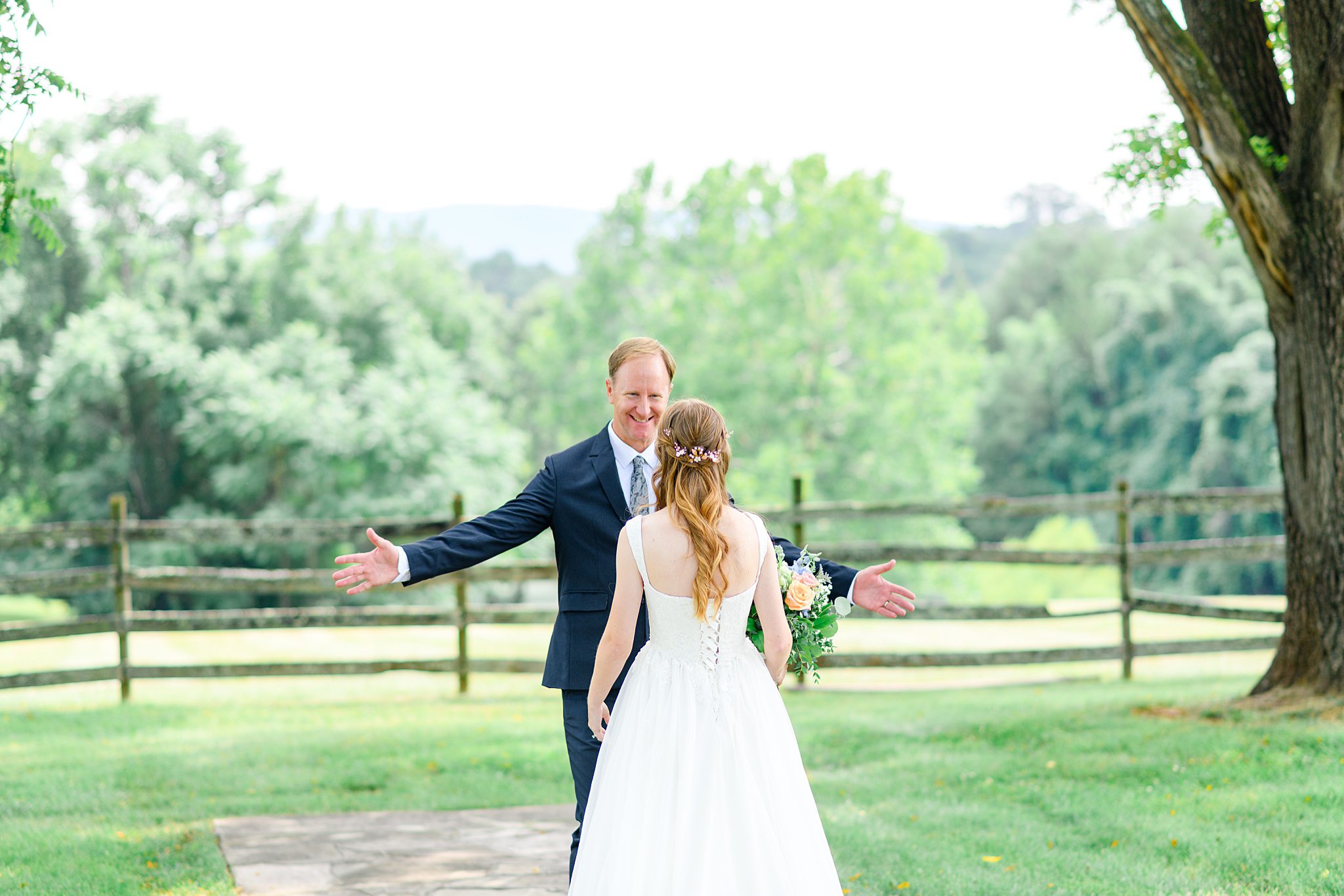father hugging bride on wedding day at Sorella Farms