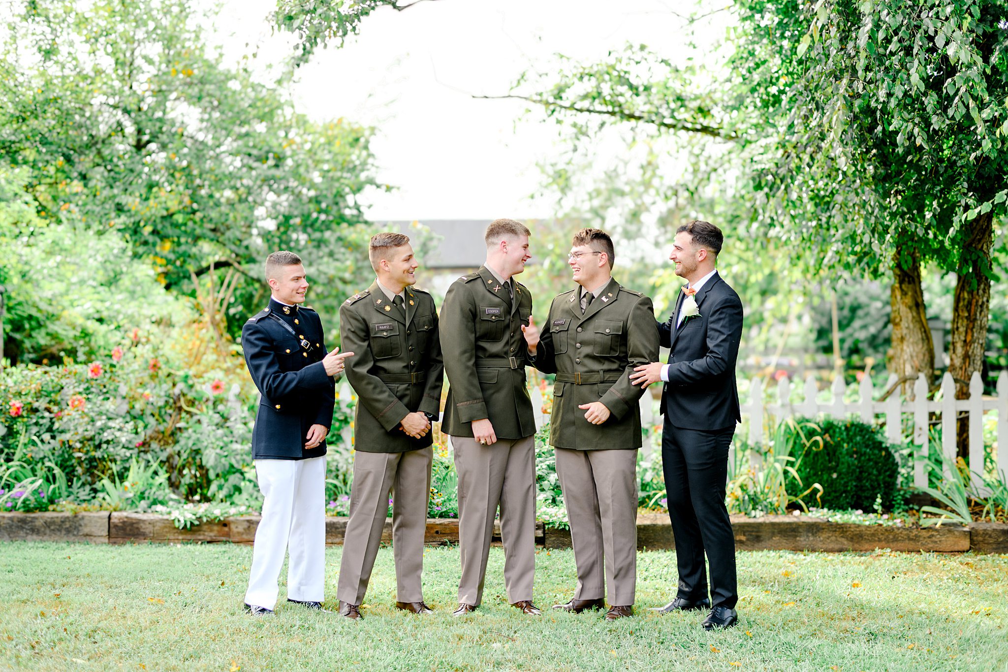 groomsmen talking in the gardens for wedding inspiration at Glencliff Mano