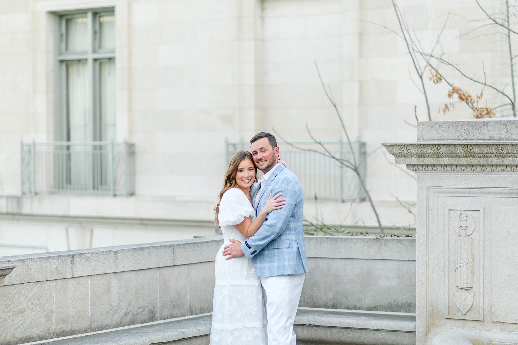 sweethearts smiling during their downtown Lynchburg engagement pictures