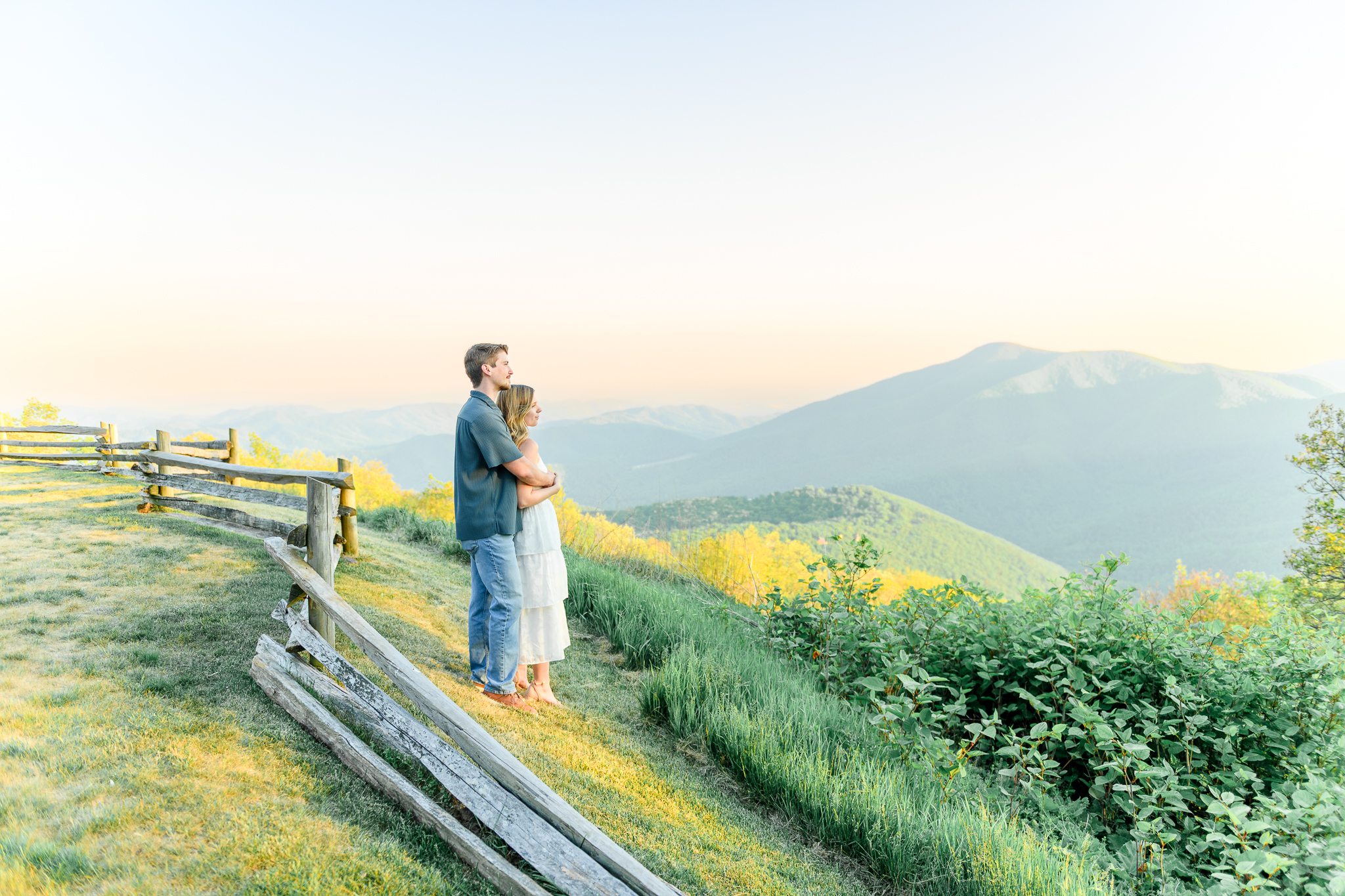 Elegant mountain engagement session at Devils Knob featuring sunset views and natural posing
