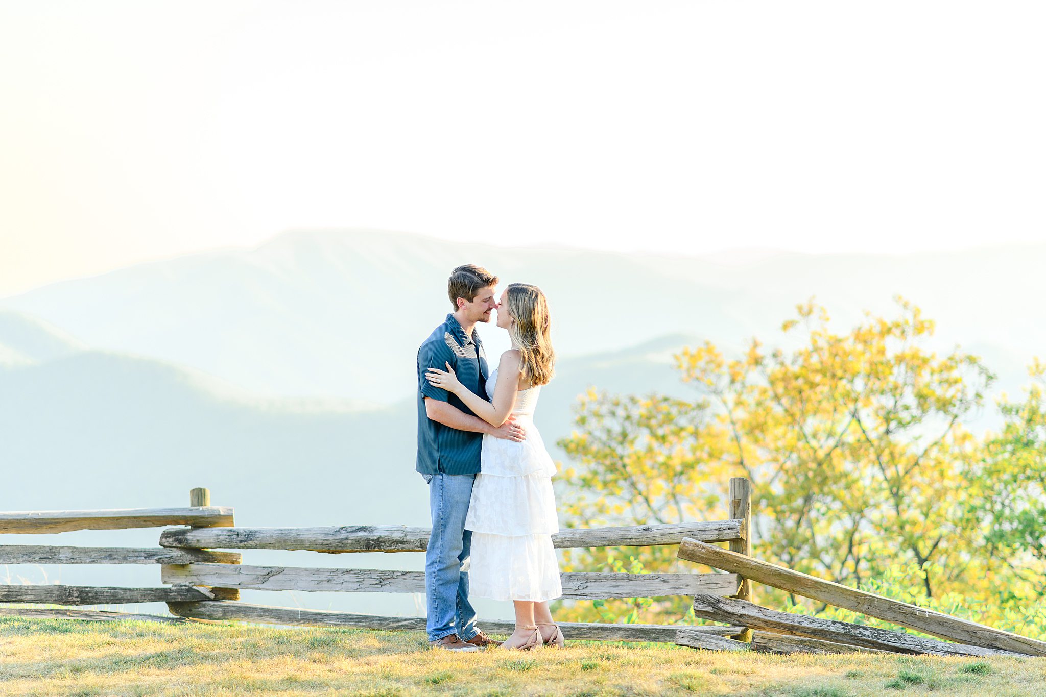 Bride and groom embracing during Ravens Roost engagement pictures near Wintergreen Virginia