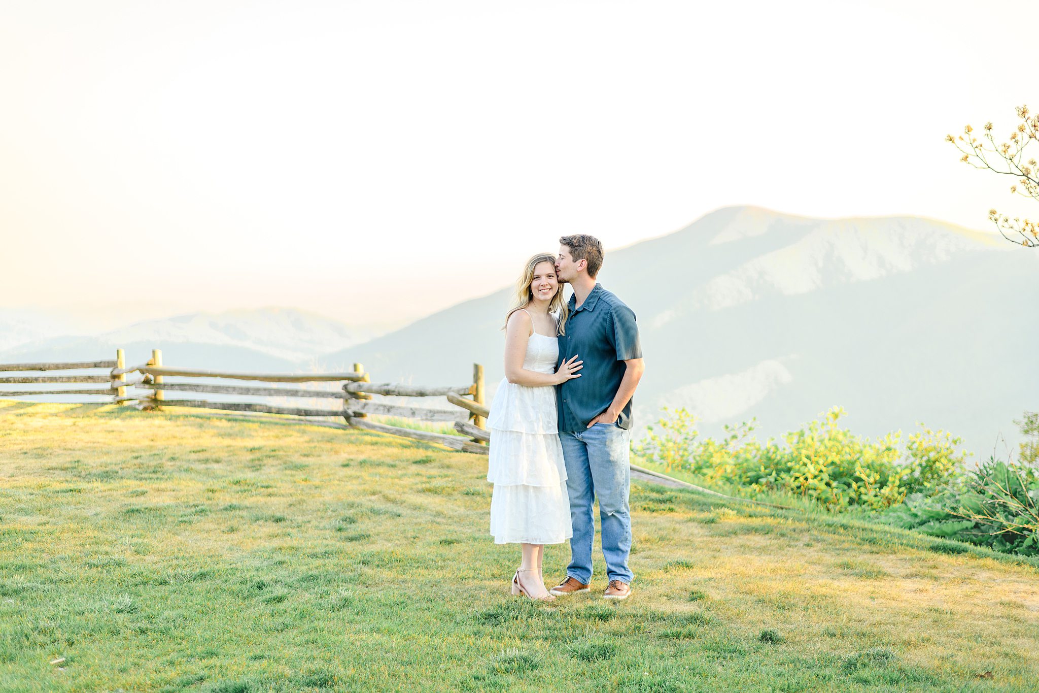 Airy and romantic Devils Knob engagement pictures with mountain scenery and golden hour light