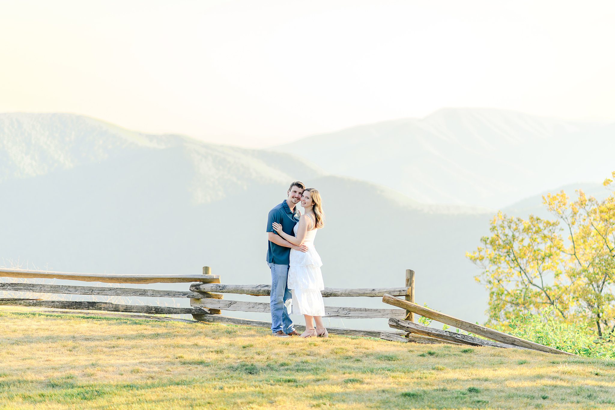 Romantic Ravens Roost engagement pictures of engaged couple at sunset overlooking the mountains