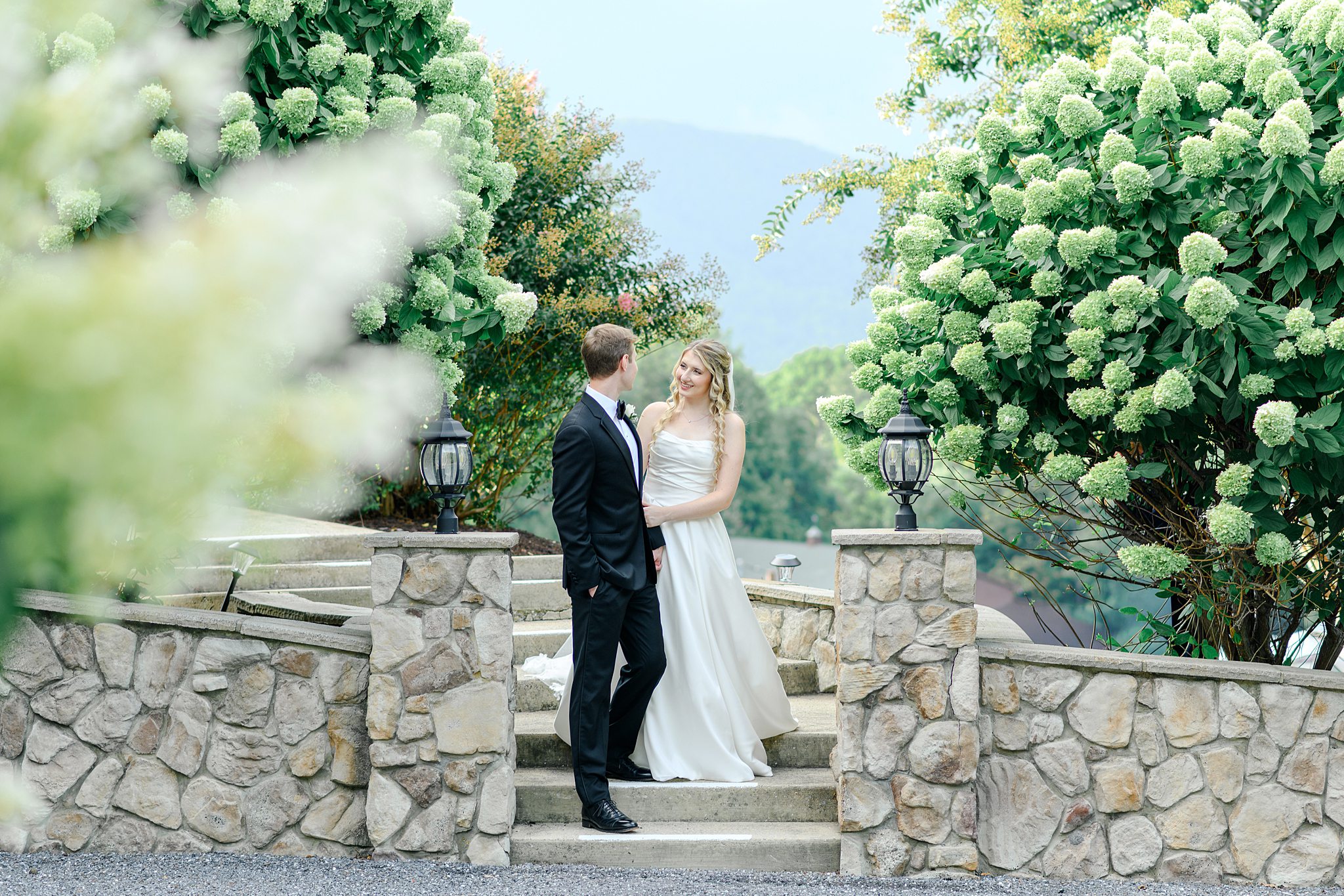 couple taking beautiful pictures with mountains in the background
