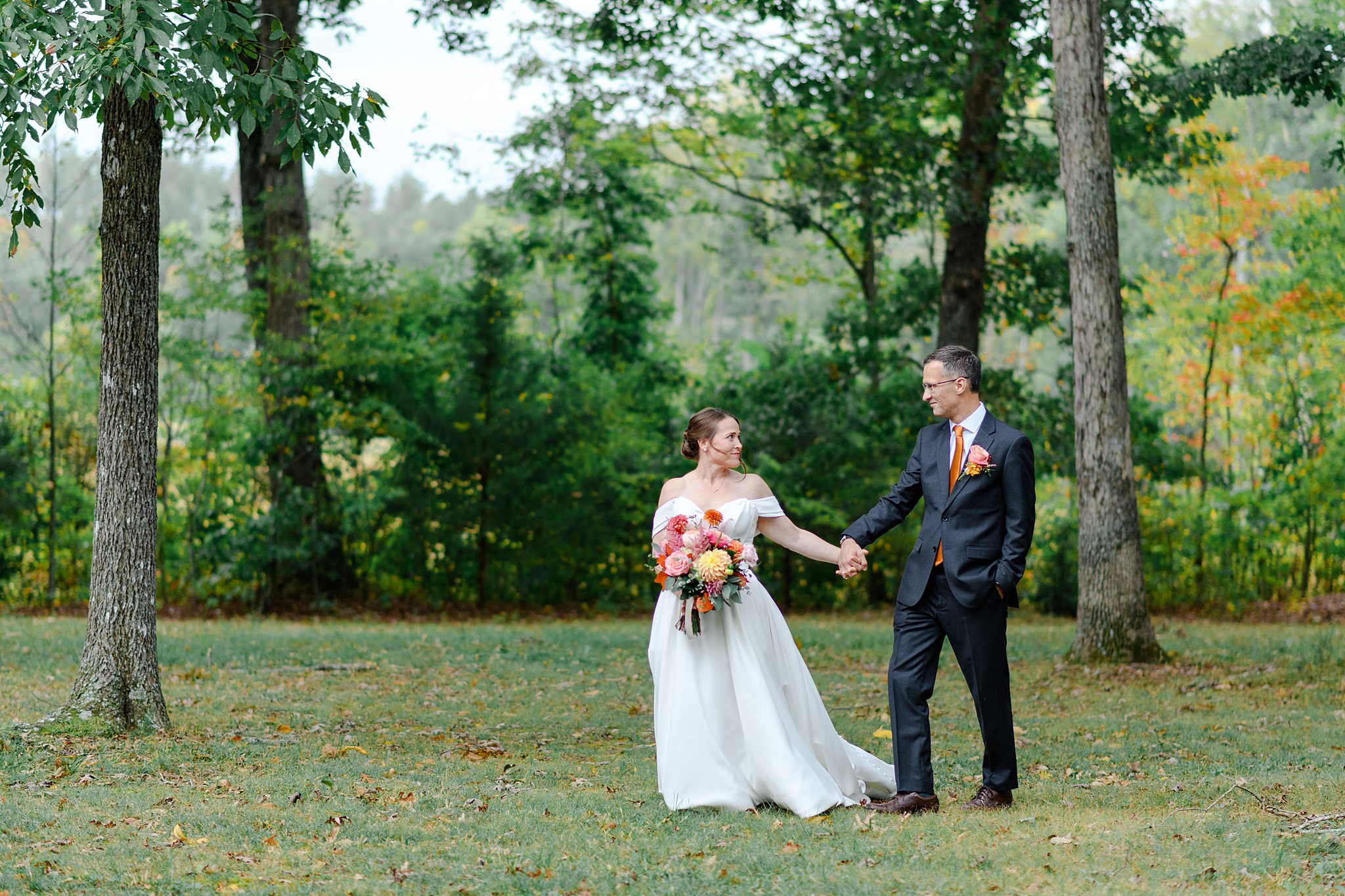 bride and groom walking outside for portraits